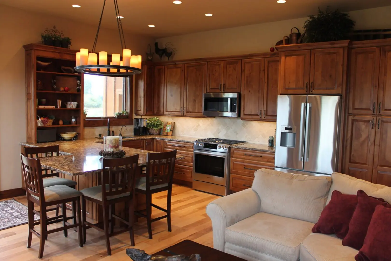 The kitchen, dining area, and living room